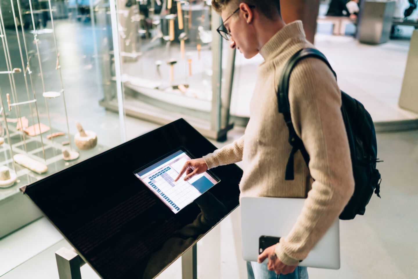 Male student using electronic information stand